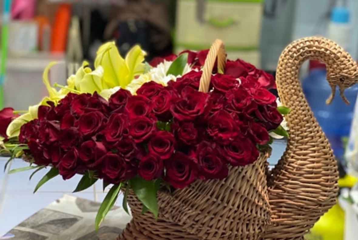 compositions with fresh flowers, soft toys and balls